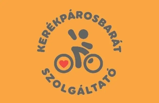 Kerékpárosbarát szolgáltató embléma narancssárga háttéren
